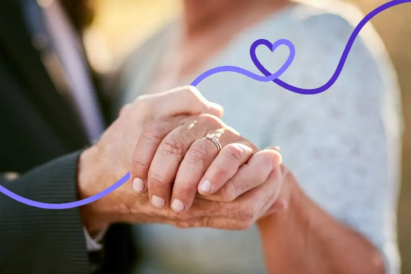 An image of a happy couple holding hands, celebrating their 50th wedding anniversary.