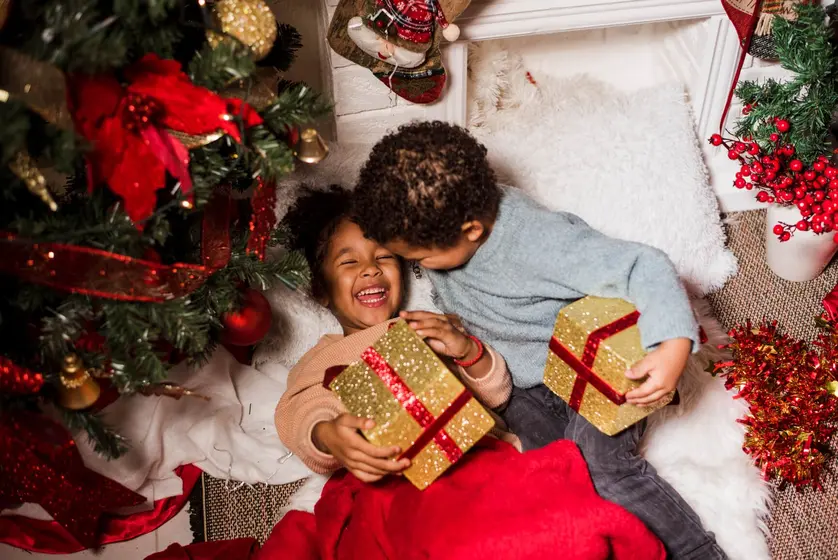 image of kids holding gifts