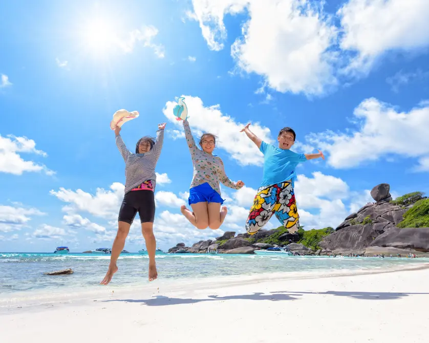 Sunny beach travel scene with happy people 