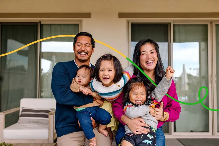 An image of a happy family posing for a picture.