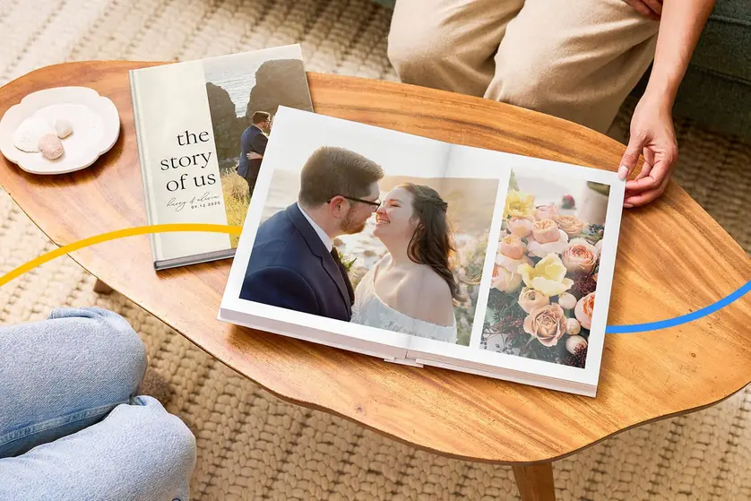 An image of a person flipping through a wedding memory book.