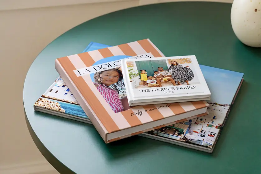 Mixbook photo book comparison guide showing a custom photo book in use