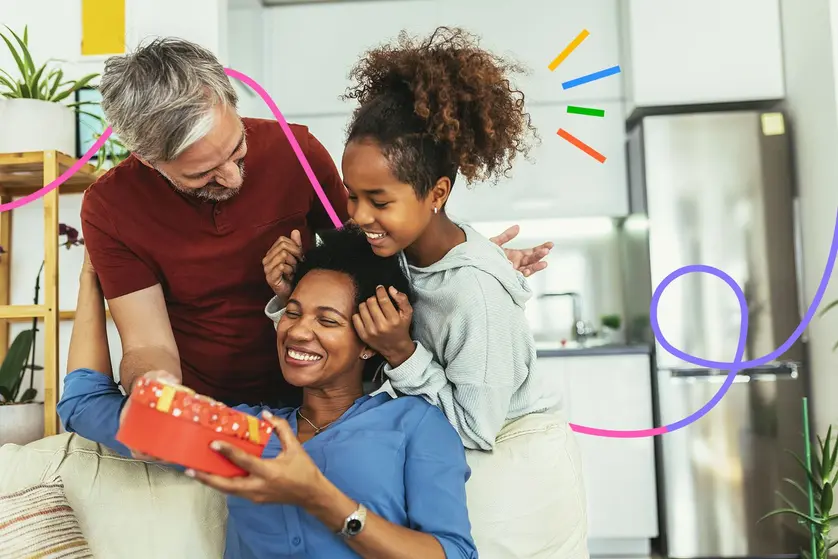 An image of a happy family giving Mom a gift on Mother’s Day.