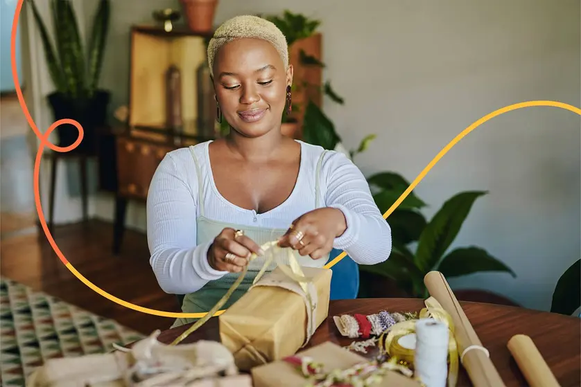 An image of a woman wrapping gifts.